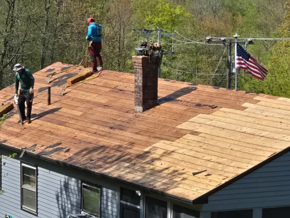 Vista Home Improvement roofing crew making a repair